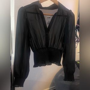Black crop top blouse. See through.